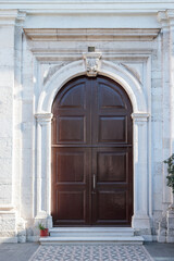 Fototapeta na wymiar The church door is a simple and elegant architecture