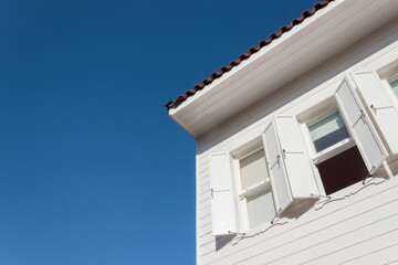 Wooden window with grille of wooden house
