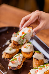 Open your mouth, garlic bread with acevichada sauce in the foreground.