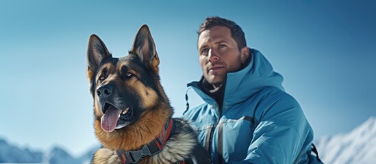 In winter a man stands alongside his German Shepherd dog framed by a blue sky within a portrait