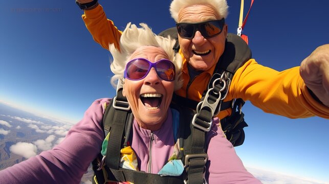 A senior or elderly couple tandem skydiving