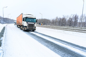 A semi-trailer truck, semitruck, tractor unit and semi-trailer to carry freight.