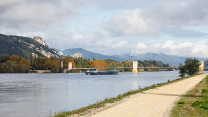 Fototapeta na wymiar River transport barge on the Rhône at Donzère