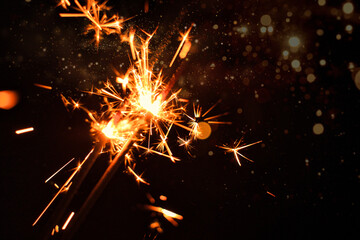 Sparkler and Fireworks - Wunderkerze - Neujahr / Silvester / Feier - Glittering - Burning Sparkler, Happy New Year ,- Blurred Bokeh Light