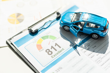 Toy car, money, documents and calculator on table. Car insurance concept