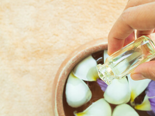 Massage Oil Aromat Spa Bath, Woman Pour Essential Oriental Aromatherapy with Soap Zen Towel Salt Rose Flowers Nature , Beauty Health Care Medicine Natural Set in Luxury Bathroom for Relax Wellness.