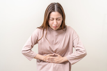 Flatulence asian young woman intolerance hand in stomach ache, suffer from food poisoning,...