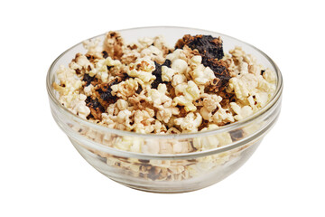 Burnt popcorn from a home microwave. Burn corn kernels on the kitchen table, isolated on white background