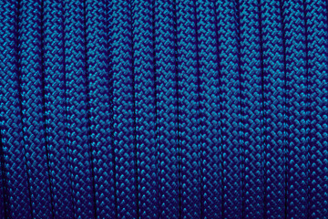 Climbing colorful blue rope as a background