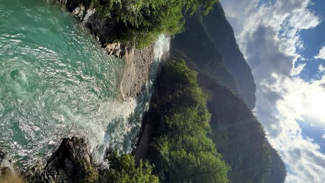 The Bolshaya Laba River. A mountain emerald river in a narrow, sunlit canyon. Bolshaya Laba River near the village of Psemen in Karachay-Cherkessia, Russia. Panoramic view. 4K