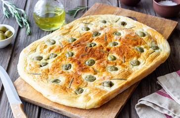 Focaccia with olives and rosemary. Italian food. Vegetarian food.