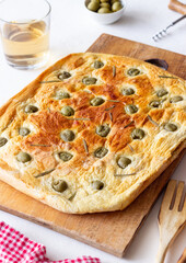Focaccia with olives and rosemary. Italian food. Vegetarian food.