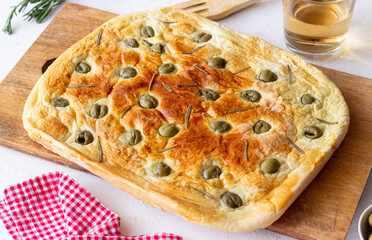 Focaccia with olives and rosemary. Italian food. Vegetarian food.