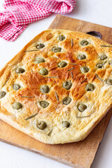 Focaccia with olives and rosemary. Italian food. Vegetarian food.