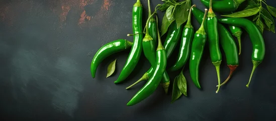 Poster Serrano Peppers with an organic green spicy flavor featured against a backdrop © 2rogan