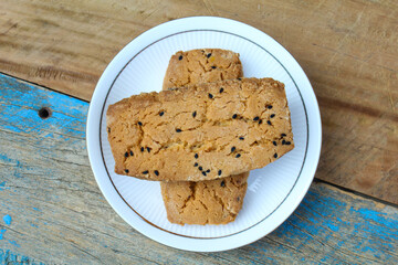 Salt Black cumin cookies in a plate on wooden background 