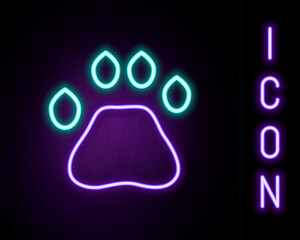 Glowing neon line Bear paw footprint icon isolated on black background. Colorful outline concept. Vector