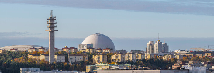 The district Hammarby and the arena globe Avicii, grey sky back ground and low morning sun light, early autumn morning in Stockholm