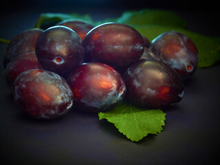 Ripe Prunes on a dark background