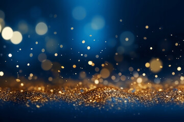 Obraz na płótnie Canvas Golden abstract bokeh on blue background. Celebrating Christmas, New Year or other holidays.
