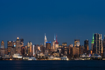 Fototapeta na wymiar New York midtown and panoramic view on office buildings at night