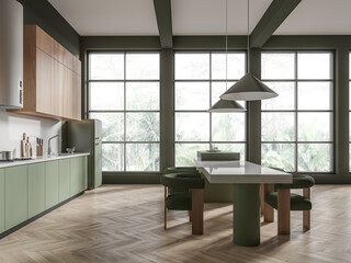 Green hotel kitchen interior with eating table, cooking space and window