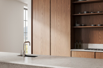 Wooden home kitchen interior with bar counter and cabinet with stove, window