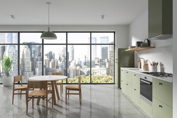 White and green kitchen interior with dining table