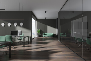 Dark gray open space office interior with clocks