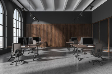 Grey glass workplace interior with pc desktop in row, panoramic window