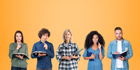 Diverse pensive student group with notebooks