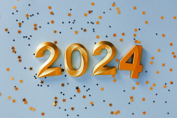 Happy New year and Christmas holiday concept 2024. Gold numbers on festive blue background. Gift card with space for text