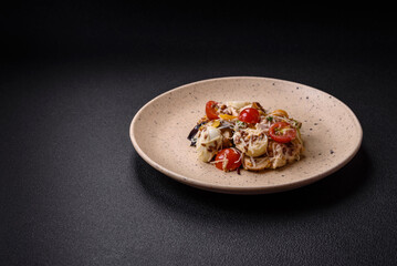 Delicious fresh salad with chicken, quail eggs, cherry tomatoes, lettuce