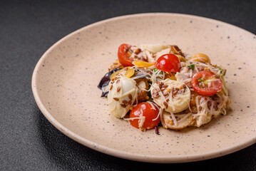 Delicious fresh salad with chicken, quail eggs, cherry tomatoes, lettuce