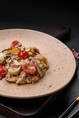 Delicious fresh salad with chicken, quail eggs, cherry tomatoes, lettuce