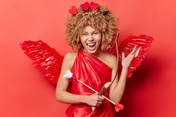 St. Valentines Day celebration. Indoor photo of young pretty excited glad African american woman in...