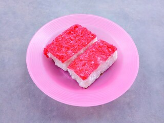 Sengkulun cake, a traditional cake made from sticky rice flour and grated coconut then steamed. Sweet wet cakes are usually served at events or as snacks at home. awuk-awuk, kue sengkulun. 
