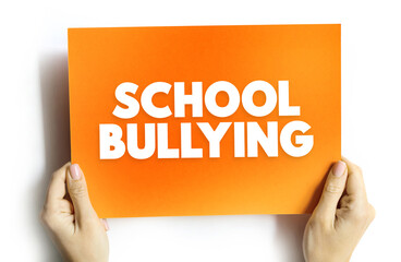 School Bullying - when one or more perpetrators who have greater physical or social power than their victim and act aggressively toward their victim by verbal or physical means, text concept on card
