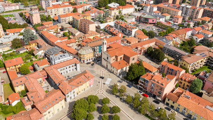 Fototapeta na wymiar Aerial view of the parish church of San Remigio in Vimodrone, in the metropolitan city and archdiocese of Milan, Italy. This Catholic place of worship is part of the deanery of Cologno Monzese.