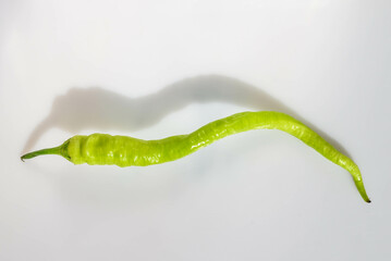 green chili pepper on white