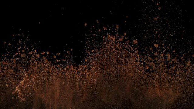Super Slow Motion Shot of Soil Explosion Isolated on Black Background at 1000fps.