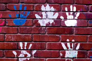 Hand print in the colourful wall