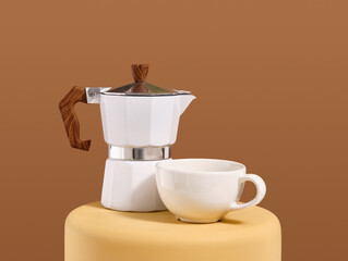 Italian geyser coffee maker and cup. Morning cappuccino.