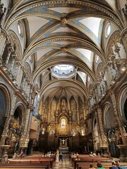 Fototapeta na wymiar The central nave and altar of the Basilica of Montserrat, Spain
