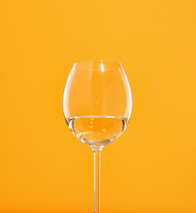 A chic glass of delicious, expensive, luxury wine on the table. Minimalist detail of cocktail party table.