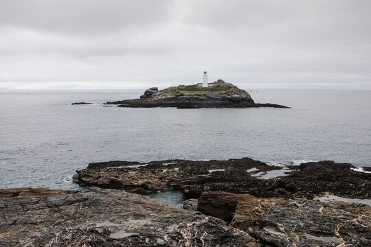 A view of the coastal waters near Godrevy Lighthouse photographed from the cliffs above the coast.