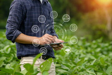 Hands of farmer, Agriculture technology farmer man using tablet Modern technology concept agriculture. - obrazy, fototapety, plakaty