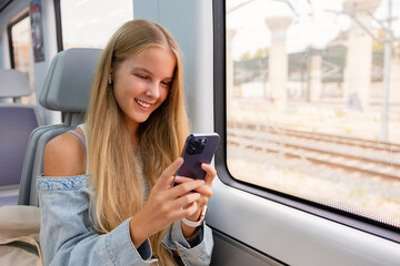 Girl using mobile phone in train