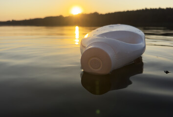 Plastic waste in lake water. Marine Plastic Pollution, Marine Debris. Wastewater Plastic bottle...