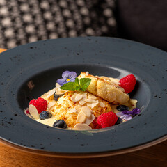 Cottage cheese pancakes with coconut and vanila sauce. Healthy and delicious morning breakfast.